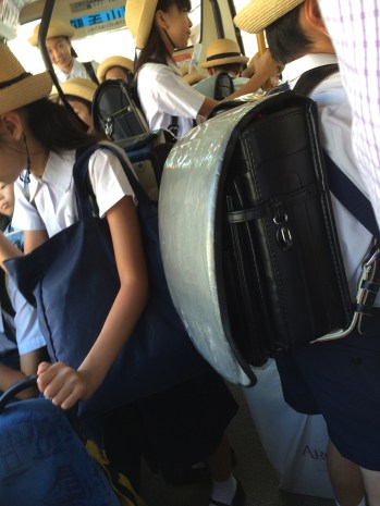 Just checking my phone! Not all taking pictures of random kids on public transportation!