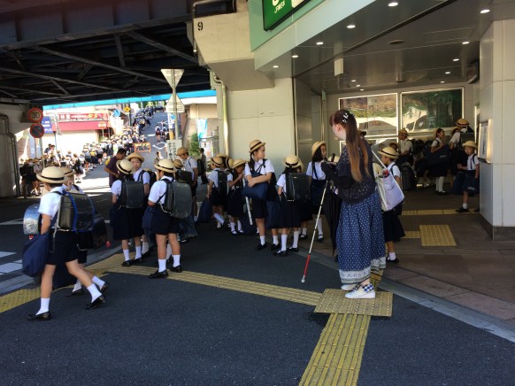 Note the stream of kids uphill in the upper left corner. The blind woman center right was not their chaperone--they had none.